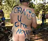 Cyclists take part in a Naked Bike Ride around the streets to expose the vulnerability of cyclists, humanity and nature in the face of cars, aggression consumerism and non-renewable energy in Melbourne on March 8, 2015. AFP PHOTO / MAL FAIRCLOUGH