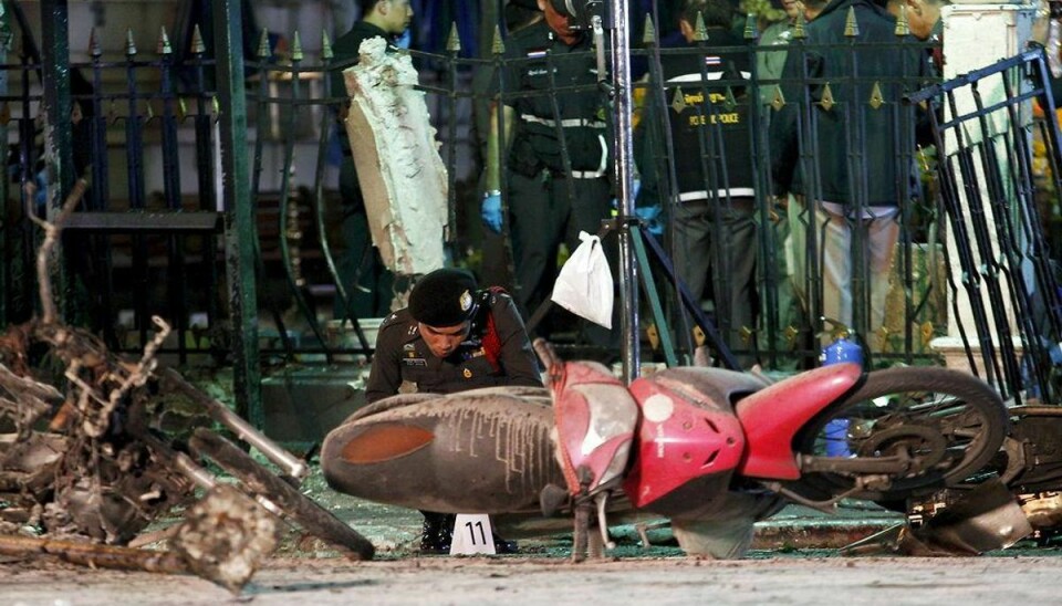 Experts investigate the remains of destroyed motorcycles at the Erawan shrine, the site of the blast in central Bangkok August 17, 2015. The bomb planted at one of the Thai capital’s most renowned shrines on Monday killed 16 people, including three foreign tourists, and wounded scores in an attack the government called a bid to destroy the economy. REUTERS/Kerek Wongsa