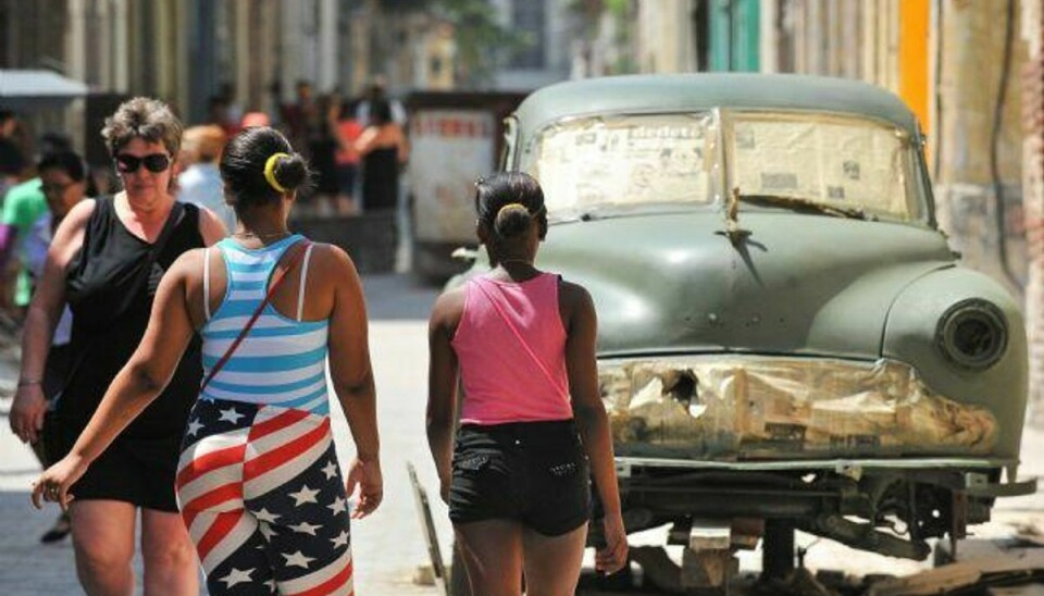 USA’s åbning over for Cuba – den gamle koldkrigsfjende – når et højdepunkt, når præsident Obama besøger landet. Målet med besøget er at sikre, at åbningen ikke kan rulles tilbage. Foto: Yamil Lage/ AFP/AFP