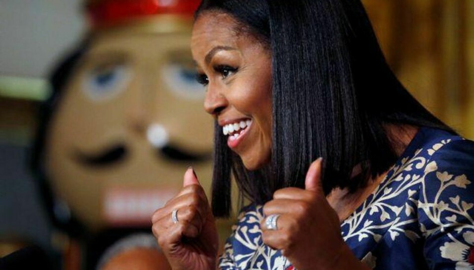 Michelle Obama nyder stor popularitet i den amerikanske befolkning, men hun vil aldrig stille op ved et præsidentvalg, slår hendes mand nu fast. Foto: Kevin Lamarque/Reuters