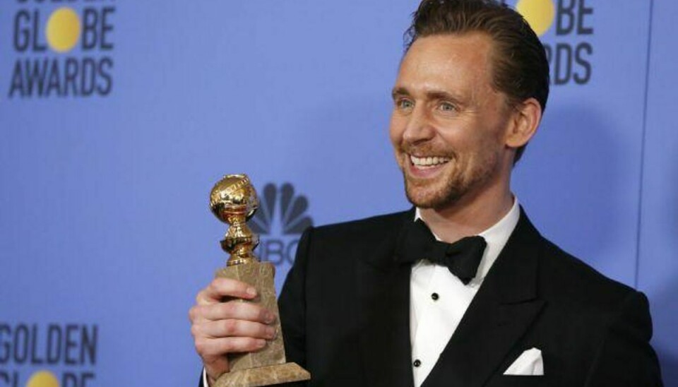 Tom Hiddleston fik prisen for årets bedste hovedrolle i en miniserie ved Golden Globe-prisuddelingen. Han fik prisen for sin rolle i “Natportieren”, der er instrueret af danske Susanne Bier. Foto: Mario Anzuoni/Reuters