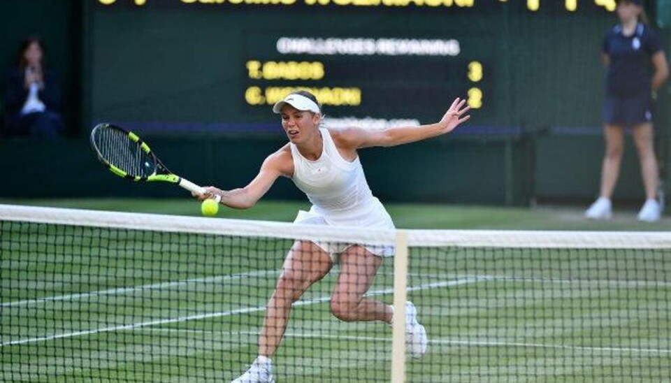 Piotr Wozniacki efter nervøs sejr: Vi var heldige Caroline Wozniacki måtte slide hårdt for sin sejr i første runde af Wimbledon. Foto: Glyn Kirk/AFP