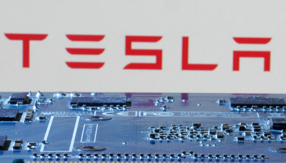FILE PHOTO: Tesla logo is seen near computer motherboard in this illustration taken January 8, 2024. REUTERS/Dado Ruvic/Illustration/File Photo