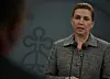 Mette Frederiksen står ved talerstol med mikrofoner under pressemøde i København.