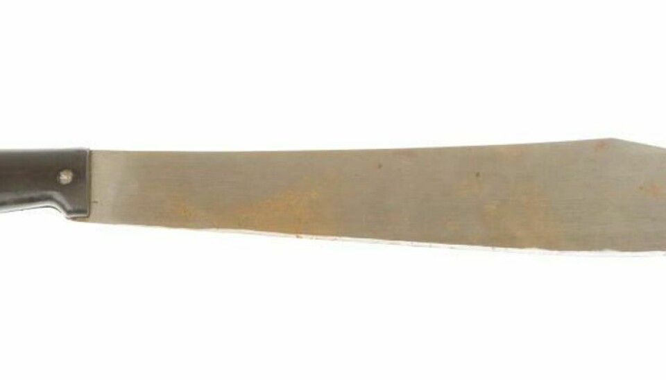 Rusted machete isolated on a white background