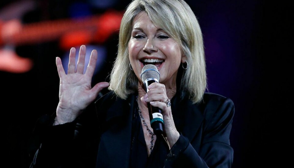 (FILES) In this file photo taken on February 23, 2017 British-Australian singer Olivia Newton-John performs at the 58th Vina del Mar International Song Festival on February 23, 2017 in Vina del Mar, Chile. - British-born Australian singer Olivia Newton-John is made a Dame Commander of the Order of the British Empire (DBE) for services to charity, cancer research and entertainment in the 2020 New Years Honours list. (Photo by PAUL PLAZA / AFP)
