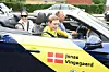 Tour de France-vinderen har i den åbne cabriolet selskab af kæresten Trine og datteren Frida. Bag rattet sad Jens Kasler fra Danmarks Cykle Union.