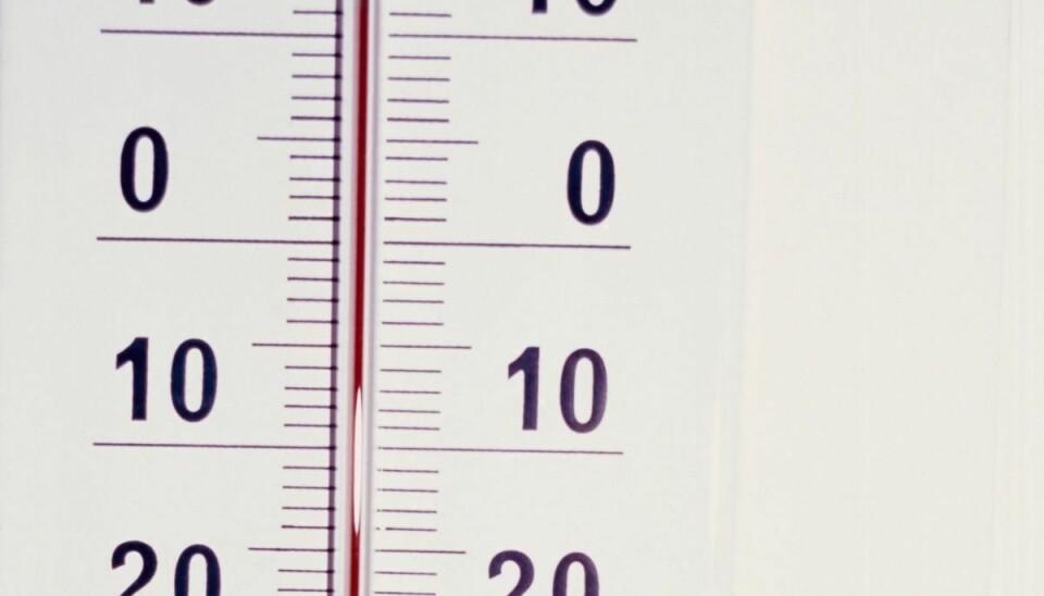 Close-up of white thermometer, measuring numbers with red mercury. Keywords: hot, cold, measurement, degrees, weather, element, thermometer, numbers, digits, red, mercury, weather, summer, winter Millennium Images, 1109