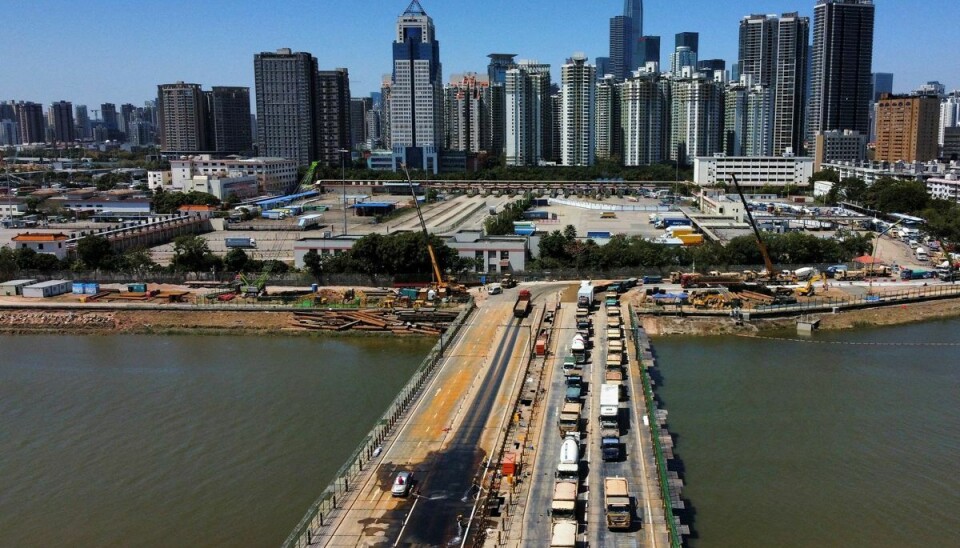 A general view shows a temporary bridge from Shenzhen to Hong Kong for transporting materials and workers to build a coronavirus disease (COVID-19) isolation facility in Lok Ma Chau, during the COVID-19 pandemic in Hong Kong, China, March 9, 2022. Picture taken with a drone. REUTERS/Tyrone Siu