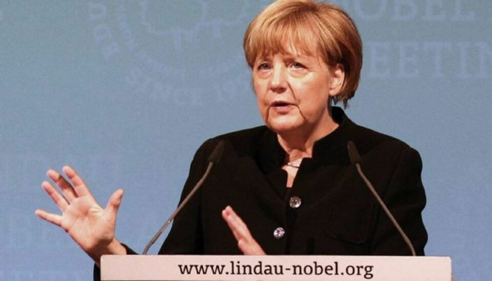Bekymret Merkel griber telefon og ringer til Putin. Foto: Karl-Josef Hildenbrand/AP
